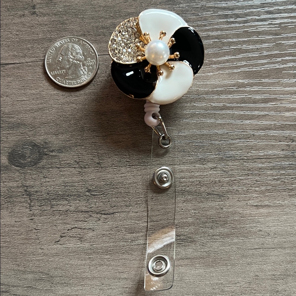 Elegant flower badge reel